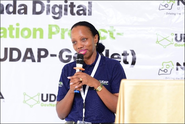 Regina Kimera addressing attendees at the event